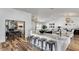 Open-concept living space featuring granite counters, stainless appliances, an open layout, and seamless flow at 6527 W Bloomfield Rd, Glendale, AZ 85304