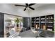 Modern home office features a stylish desk, shelving, and view into the open living area at 6527 W Bloomfield Rd, Glendale, AZ 85304