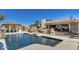Backyard pool featuring rock waterfalls, slide, and gazebo near house with tiled roof at 6527 W Bloomfield Rd, Glendale, AZ 85304