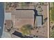 Drone shot of the house from above showing the rooftop, landscaping, and fencing at 6756 W Patriot Way, Florence, AZ 85132