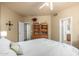 Comfortable bedroom featuring a ceiling fan, plush carpet, and a cozy ambiance at 6963 W Aurora Dr, Glendale, AZ 85308
