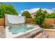 Private backyard hot tub with tiled surround, perfect for relaxation at 6963 W Aurora Dr, Glendale, AZ 85308