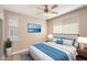 Inviting bedroom features a ceiling fan, mounted TV, and ample natural light from the window at 7009 E Acoma Dr # 2134, Scottsdale, AZ 85254
