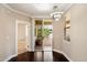 Dining room leading to a patio features hardwood floors, modern lighting, and neutral walls at 7009 E Acoma Dr # 2134, Scottsdale, AZ 85254