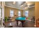 Relaxing game room features a billiard table, recessed lighting, and natural light from multiple windows at 7009 E Acoma Dr # 2134, Scottsdale, AZ 85254