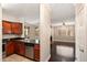 Open concept kitchen with stainless steel appliances leading into a living area with a fireplace at 7009 E Acoma Dr # 2134, Scottsdale, AZ 85254