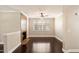 Inviting living room with a cozy fireplace, hardwood floors, and natural light from a large window at 7009 E Acoma Dr # 2134, Scottsdale, AZ 85254