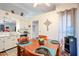 Cozy dining area with a Saltillo tile floor and an adjacent kitchen with white cabinets at 7138 W Sierra Vista W Dr, Glendale, AZ 85303