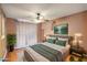 Comfortable main bedroom featuring a ceiling fan and natural lighting at 7138 W Sierra Vista W Dr, Glendale, AZ 85303