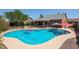 Gorgeous in-ground pool with a safety fence and an inviting backyard at 7138 W Sierra Vista W Dr, Glendale, AZ 85303