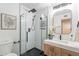 Modern bathroom with a glass-enclosed shower, stylish vanity, and contemporary fixtures at 726 W El Camino W Dr, Phoenix, AZ 85021