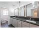 Modern bathroom boasts a large gray countertop with double sinks and stylish lighting at 726 W El Camino W Dr, Phoenix, AZ 85021