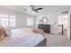 Comfortable bedroom with lots of light, a dresser and view to hall at 726 W El Camino W Dr, Phoenix, AZ 85021