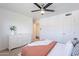 Carpeted bedroom features a ceiling fan and a chest of drawers near the bed at 726 W El Camino W Dr, Phoenix, AZ 85021