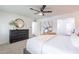 Relaxing bedroom with a large dresser, cozy bed, and neutral color palette at 726 W El Camino W Dr, Phoenix, AZ 85021