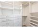 Organized walk-in closet with ample shelving and drawers for storage at 726 W El Camino W Dr, Phoenix, AZ 85021