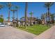 Traditional style two-story home with mature landscaping, large shade trees, and a well manicured green lawn at 726 W El Camino W Dr, Phoenix, AZ 85021