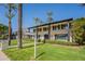 Traditional-style home featuring a lush lawn, mature landscaping, and an inviting facade with timeless charm at 726 W El Camino W Dr, Phoenix, AZ 85021