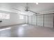 Spacious and bright garage offering ample parking and storage with clean concrete floors and white walls at 726 W El Camino W Dr, Phoenix, AZ 85021