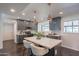 Stylish kitchen with gray cabinets, white backsplash, and stainless steel appliances at 726 W El Camino W Dr, Phoenix, AZ 85021