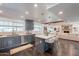 Open concept kitchen featuring gray cabinets, quartz countertops, and stainless steel appliances at 726 W El Camino W Dr, Phoenix, AZ 85021