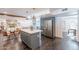 Open kitchen featuring gray cabinets, stainless appliances, and a connected dining area at 726 W El Camino W Dr, Phoenix, AZ 85021
