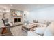 Cozy living room with a brick fireplace, built-in shelves, and a comfortable sofa at 726 W El Camino W Dr, Phoenix, AZ 85021