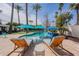 Inviting pool area with lounge chairs, umbrellas, and desert landscaping at 726 W El Camino W Dr, Phoenix, AZ 85021