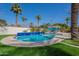 Beautiful backyard swimming pool with blue tiling, a white fence, and palm trees at 726 W El Camino W Dr, Phoenix, AZ 85021