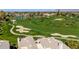 Scenic aerial view overlooking the golf course, ponds, and surrounding neighborhood at 7400 E Gainey Club Dr # 123, Scottsdale, AZ 85258