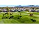 Beautiful aerial view showcasing the community homes and lush green golf course at 7400 E Gainey Club Dr # 123, Scottsdale, AZ 85258