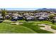 Expansive aerial view showing homes nestled along the well-manicured golf course at 7400 E Gainey Club Dr # 123, Scottsdale, AZ 85258
