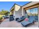 Spacious back patio featuring lounge chairs, grill, and seamless indoor-outdoor living at 7400 E Gainey Club Dr # 123, Scottsdale, AZ 85258