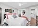 Comfortable bedroom with white bedding, decorative pillows, and a ceiling fan at 7400 E Gainey Club Dr # 123, Scottsdale, AZ 85258