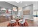 Elegant dining area with a glass table, comfortable seating, and stylish decor at 7400 E Gainey Club Dr # 123, Scottsdale, AZ 85258