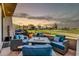 Outdoor patio featuring golf course views, comfortable seating and gas grill at 7400 E Gainey Club Dr # 123, Scottsdale, AZ 85258