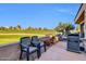 Relaxing outdoor patio with a grill and scenic golf course views at 7400 E Gainey Club Dr # 123, Scottsdale, AZ 85258