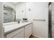 Bright bathroom featuring a marble countertop, neutral color palette, and sliding glass shower doors at 8401 N 84Th Pl, Scottsdale, AZ 85258