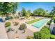Well-maintained community amenity area with shuffleboard court and desert landscaping at 8401 N 84Th Pl, Scottsdale, AZ 85258