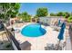 Inviting community pool area with comfortable seating and shade umbrellas at 8401 N 84Th Pl, Scottsdale, AZ 85258