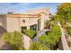 Home exterior showcasing private patio, mature landscaping, and architectural detail at 8401 N 84Th Pl, Scottsdale, AZ 85258