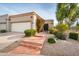 Charming home featuring a well-maintained exterior with a two car garage and landscaped yard at 8401 N 84Th Pl, Scottsdale, AZ 85258