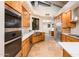 Modern kitchen features custom wood cabinets, marble countertops, and stainless steel appliances at 8401 N 84Th Pl, Scottsdale, AZ 85258