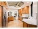 Well-designed kitchen with custom cabinets, stainless steel appliances, and view to the dining room at 8401 N 84Th Pl, Scottsdale, AZ 85258
