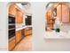 Gourmet kitchen with custom wood cabinetry, stone countertops, stainless steel appliances, and ample counter space at 8401 N 84Th Pl, Scottsdale, AZ 85258