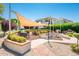 Inviting outdoor patio with covered seating, fire pit, and BBQ area for relaxing or entertaining guests at 8401 N 84Th Pl, Scottsdale, AZ 85258