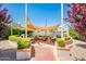 Lakeside patio with shaded seating, perfect for relaxing and enjoying the tranquil views and outdoor kitchen at 8401 N 84Th Pl, Scottsdale, AZ 85258