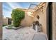 Inviting patio featuring a stainless steel grill, lush greenery, custom shade structure, and decorative tile accents at 8401 N 84Th Pl, Scottsdale, AZ 85258