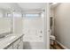 Bathroom with a granite sink, shower/tub combo, and tile surround at 9306 E Fairbrook St, Mesa, AZ 85207