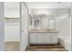 Bathroom featuring a double vanity with granite counters and a shower-tub combo at 9306 E Fairbrook St, Mesa, AZ 85207